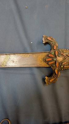 Lot 448 - An Ottoman gold-damascened steel kilij sword