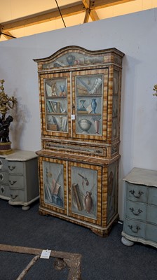 Lot 336 - A large painted tromp l'oeil cabinet