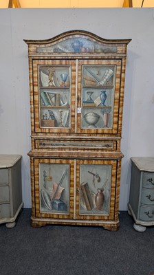 Lot 336 - A large painted tromp l'oeil cabinet