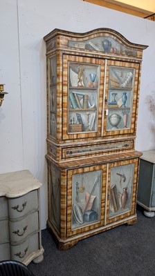 Lot 336 - A large painted tromp l'oeil cabinet