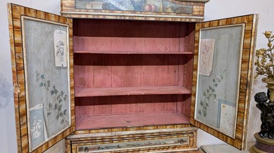 Lot 336 - A large painted tromp l'oeil cabinet
