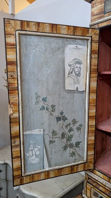 Lot 336 - A large painted tromp l'oeil cabinet