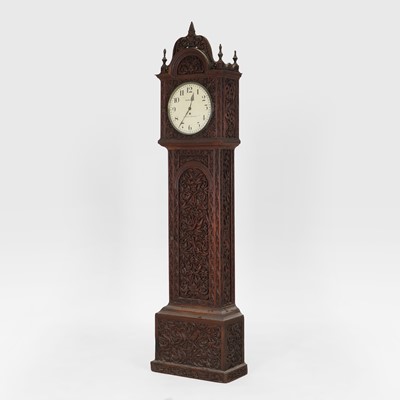 Lot 438 - A carved rosewood longcase clock