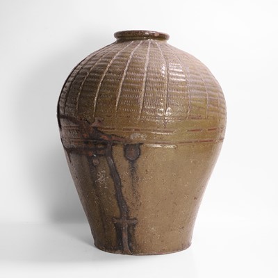 Lot 137 - A large green-glazed pottery vase
