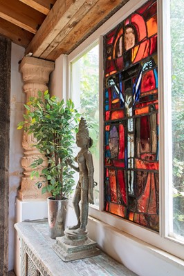Lot 497 - A large stained-glass panel in the manner of John Piper and Patrick Reyntiens