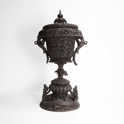 Lot 424 - A carved blackwood cup and cover