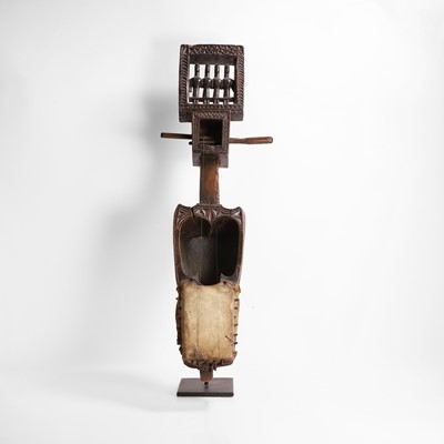 Lot 417 - A carved wooden and hide 'dhodro banam' lute