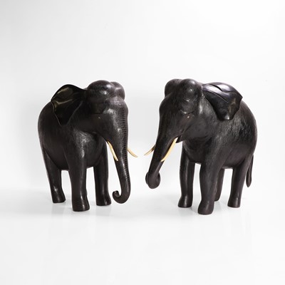 Lot 84 - A large pair of ebony and lacquered elephants