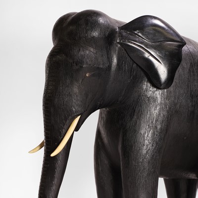 Lot 84 - A large pair of ebony and lacquered elephants