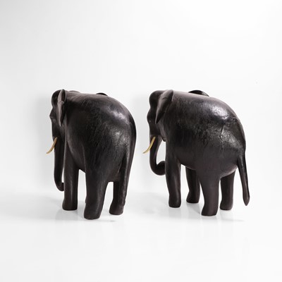 Lot 84 - A large pair of ebony and lacquered elephants
