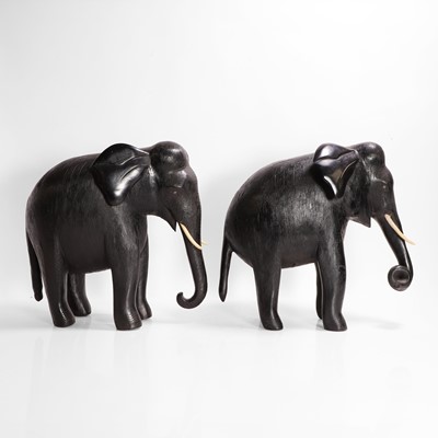 Lot 84 - A large pair of ebony and lacquered elephants