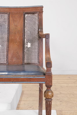 Lot 52 - A set of six oak and cane elbow chairs