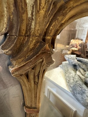 Lot 44 - A George III-style carved giltwood overmantel mirror