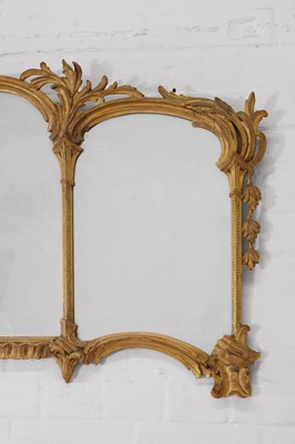 Lot 44 - A George III-style carved giltwood overmantel mirror