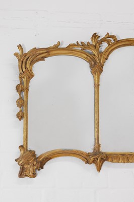 Lot 44 - A George III-style carved giltwood overmantel mirror