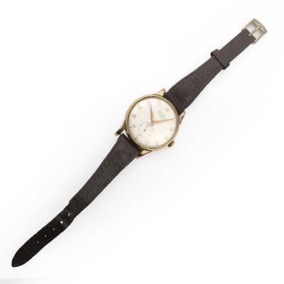 Lot 36 - A gold Trebex mechanical strap watch, a silver pocket watch and a silver fob watch