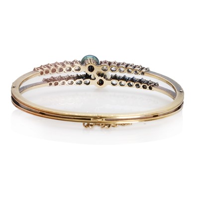 Lot 55 - An 18ct gold diamond and pearl hinged bangle