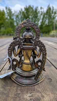 Lot 124 - A gilt-copper bodhisattva
