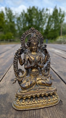 Lot 124 - A gilt-copper bodhisattva