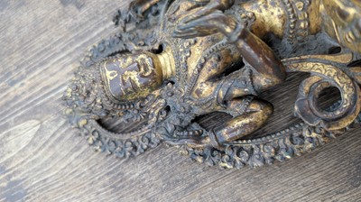 Lot 124 - A gilt-copper bodhisattva