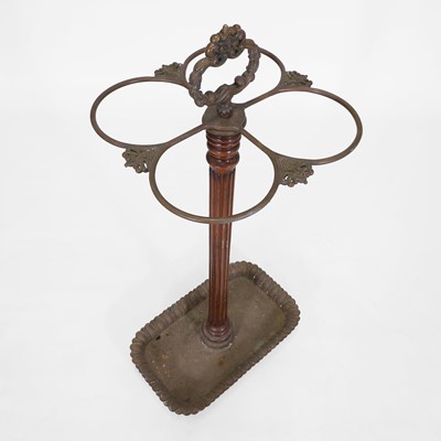 Lot 80 - A walnut and brass stick stand