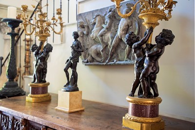 Lot 58 - A pair of large gilt-bronze, bronze, and porphyry candelabra after Jean-Louis Prieur