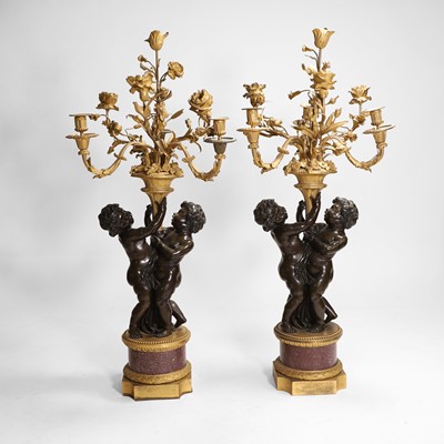 Lot 58 - A pair of large gilt-bronze, bronze, and porphyry candelabra after Jean-Louis Prieur