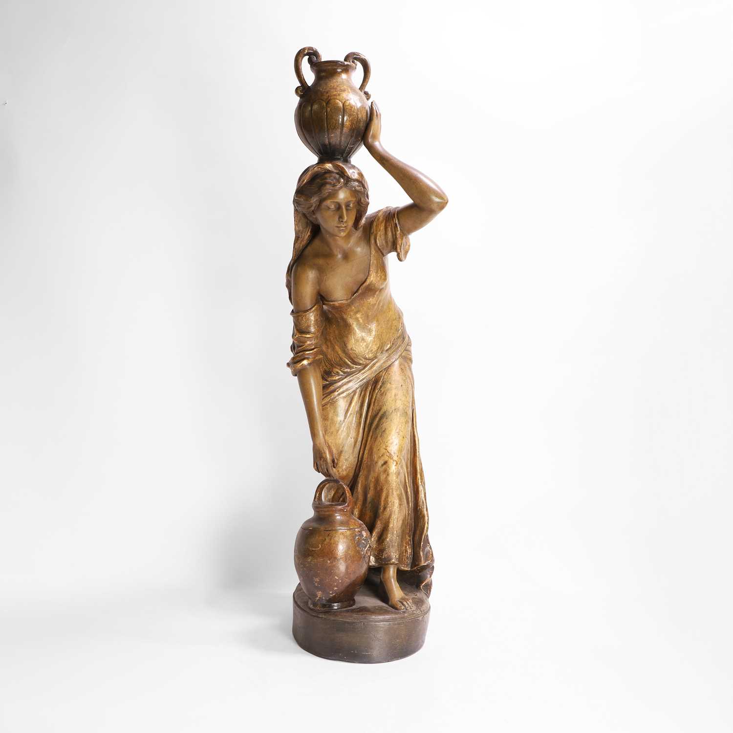 Lot 65 - A Goldscheider pottery figure of a female water carrier