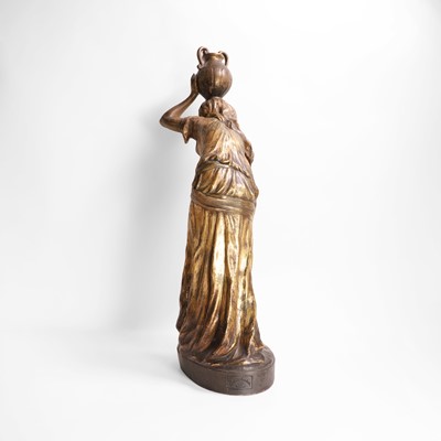 Lot 65 - A Goldscheider pottery figure of a female water carrier