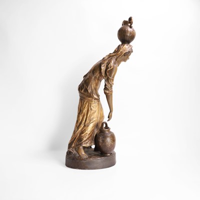 Lot 65 - A Goldscheider pottery figure of a female water carrier