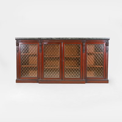Lot 530 - A mahogany and ebonised breakfront bookcase cabinet in the manner of Gillows