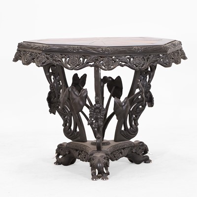 Lot 429 - An ebony and specimen wood centre table