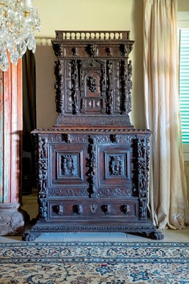 Lot 449 - A carved walnut 'a bambocci' cabinet