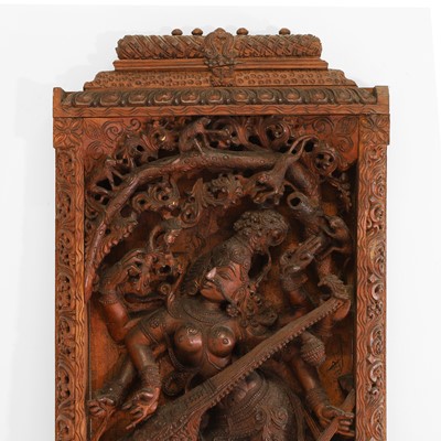 Lot 628 - A carved wood panel