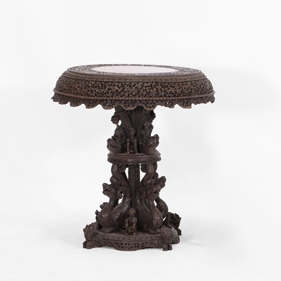 Lot 437 - A carved teak and rosewood occasional table