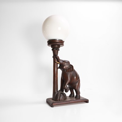 Lot 377 - A carved table lamp