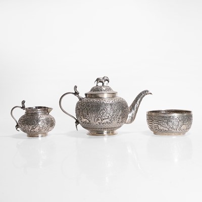 Lot 442 - A white-metal three-piece tea set