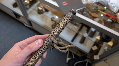 Lot 426 - Three gilt-iron pen cases