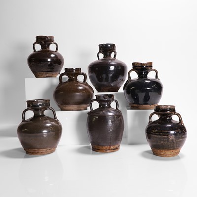 Lot 284 - A collection of seven black-glazed jars