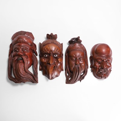 Lot 489 - A collection of four wood carvings