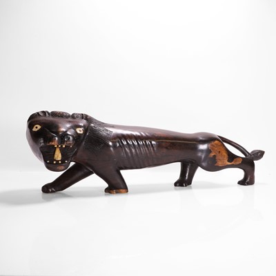 Lot 408 - A carved hardwood lion