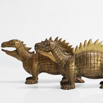 Lot 20 - A pair of large dinosaur brass nutcrackers