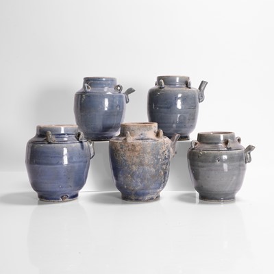 Lot 286 - A collection of five blue-glazed jugs