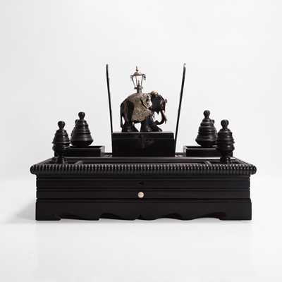 Lot 259 - An ebonised desk stand