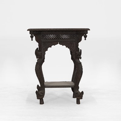 Lot 581 - A carved rosewood occasional table