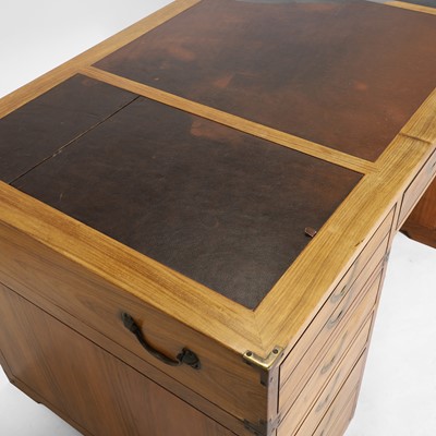 Lot 116 - A teak and brass-mounted pedestal desk by Starbay