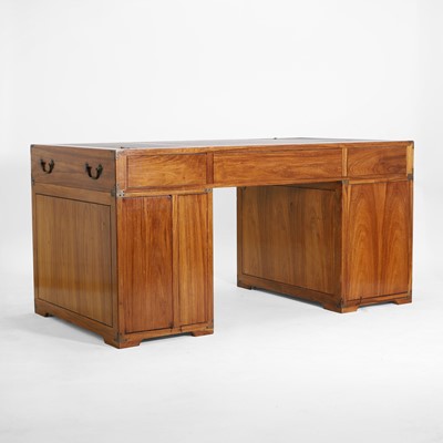 Lot 116 - A teak and brass-mounted pedestal desk by Starbay