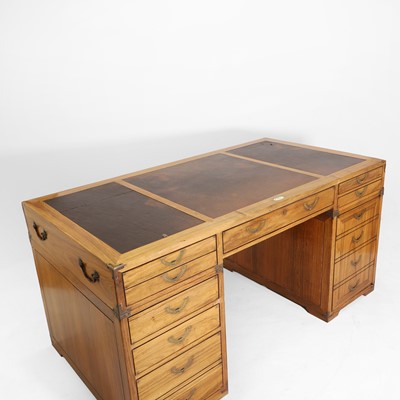 Lot 116 - A teak and brass-mounted pedestal desk by Starbay