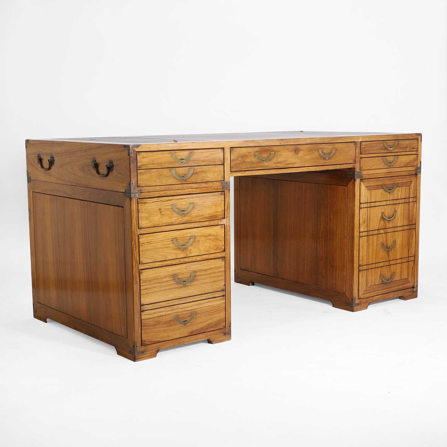 Lot 116 - A teak and brass-mounted pedestal desk by Starbay