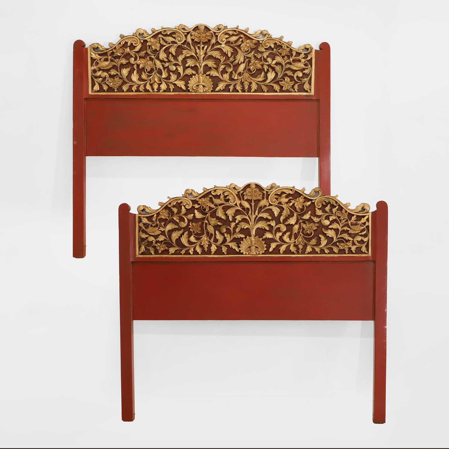 Lot 89 - A pair of carved, gilt and lacquered headboards